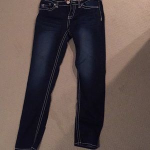 Dark mid rise jeggings with white stitching